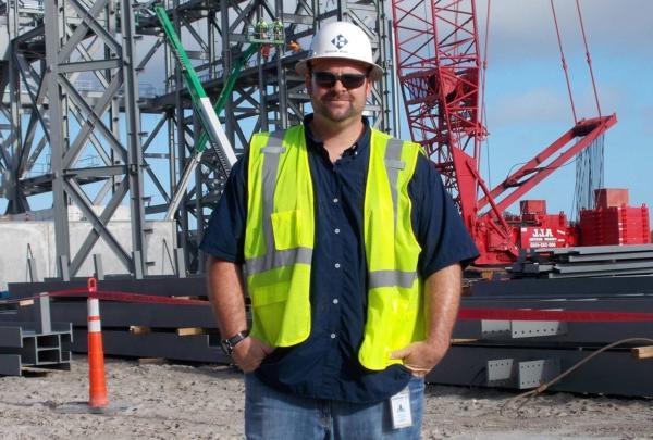 澳门足彩app's Aaron Ware posing on a jobsite.